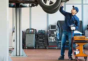 Garage Insurance mechanic under car