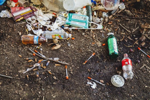 opioid epidemic bottles on ground opioid bottles and needles all over the ground